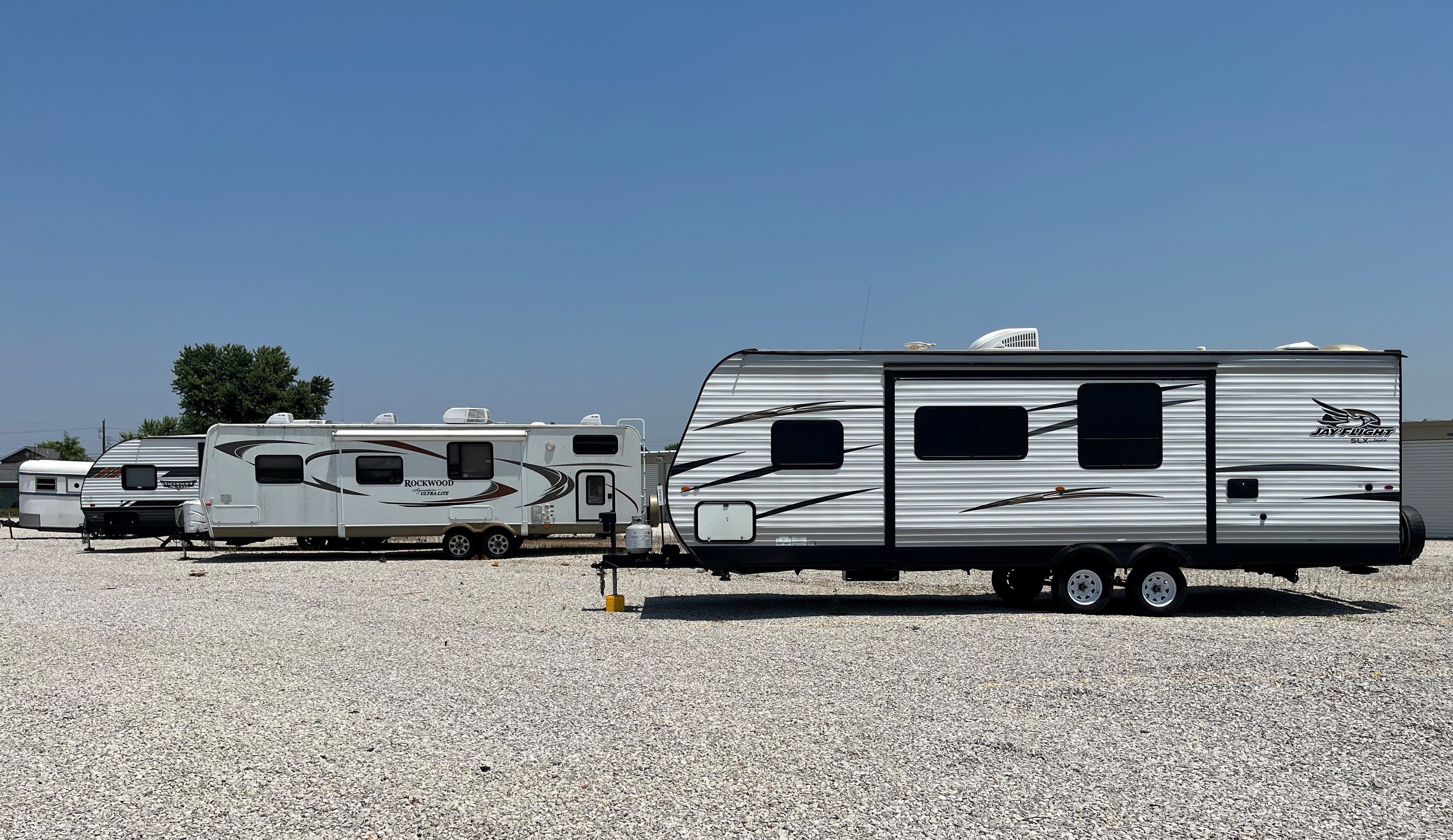 Outdoor RV parking area at Huntingburg Access Storage, offering spacious and secure spots for convenient vehicle storage.